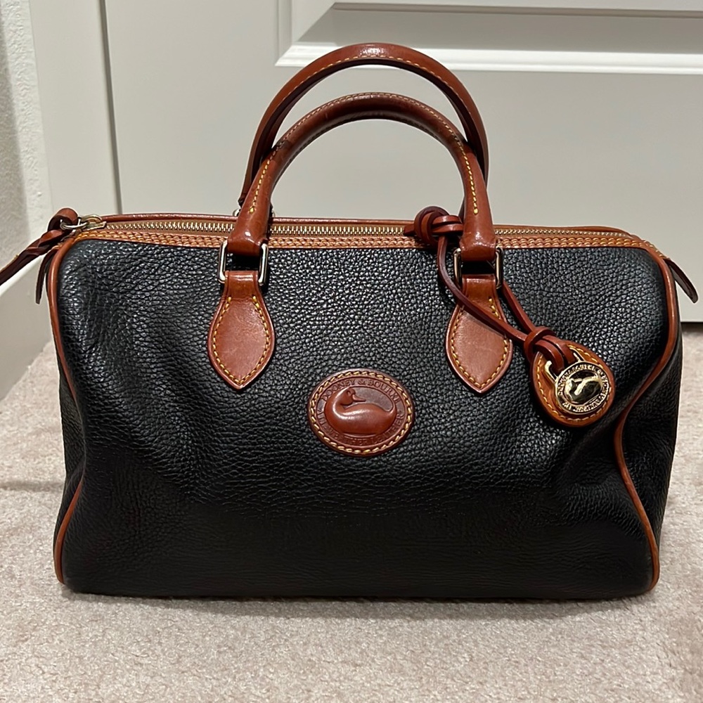 Dooney & Bourke - Black pebbled with brown leather handles and zippers